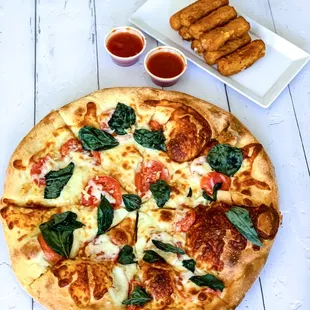 a pizza and dipping sauces