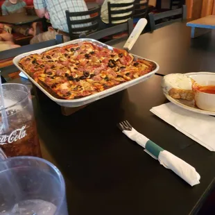 a pan of pizza on a table