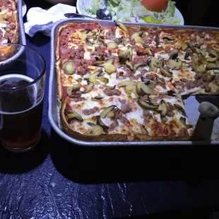 Sausage, mushroom and onion--the pizza here is on point! Paired with a Riverwest Stein.