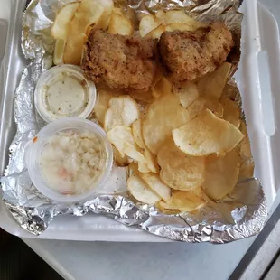 Fish and chips. 4 pieces of fish, rye bread and coleslaw.    Unique but good and light breading for $9.50.