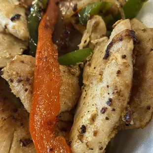 Pollo a la Plancha - Grilled chicken breast with vegetable and traditional Puerto Rican seasoning.