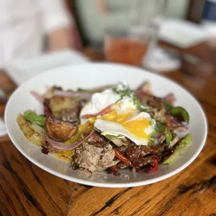 a plate of food on a wooden table
