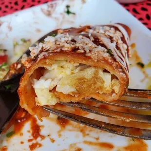 Inside of scrambled eggs enchiladas rojas