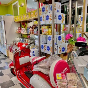 a red scooter in a store