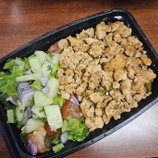 a salad in a plastic container