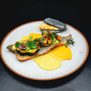 Mole amarillo made with butternut squash, served with salsa frita, farm raised trout from Idaho, seasonal squash, and lemon balm.