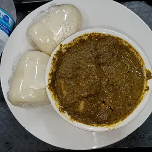 a plate of food and a bottle of water