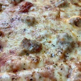 Thin crust, sausage pizza