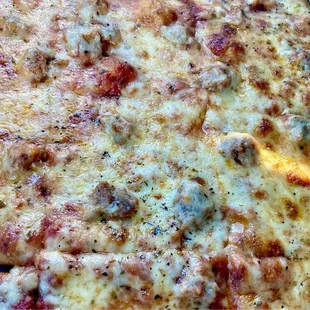 Thin crust, sausage pizza