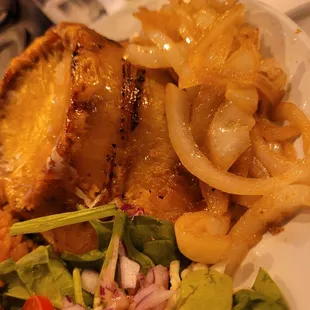 Pastelon Sweet plantain stuffed with ground beef and topped with cheese.