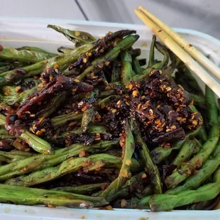 Szechuan string beans. They fried them today, they tasted boiled last time. Taste is improved!