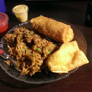 Beef fried rice, egg roll, and crab ragoon. You get way more food than what's on this plate from a small portion!