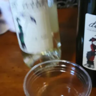 a glass of wine and a bottle of wine