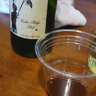 a glass of wine and a bottle of wine