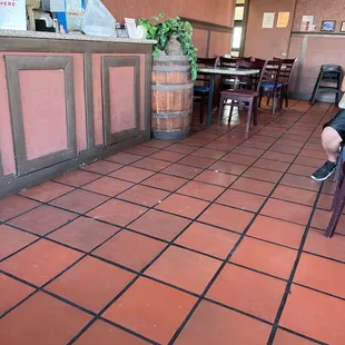 a woman sitting on a chair in a restaurant