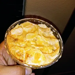 a hand holding a pie