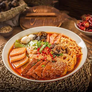 a bowl of noodles and meat