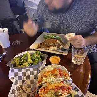 a man eating a meal at a restaurant