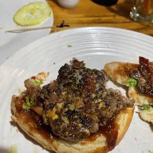 The scrapped off cheese remnants from my patty that they put on, then flipped over so I wouldn't notice.