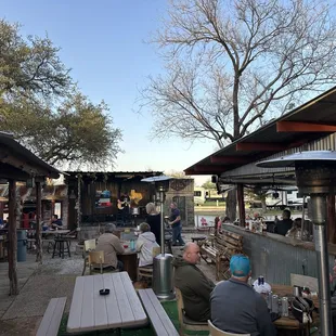 people sitting at tables outside