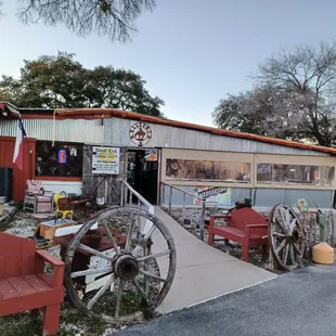 an old wagon and wagon wheel