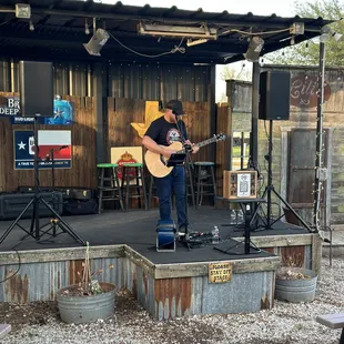 a man playing a guitar