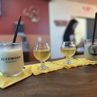 three glasses of beer on a table