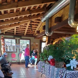 a woman sitting on a bench in a restaurant