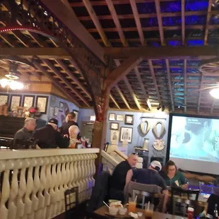 a group of people sitting in a restaurant