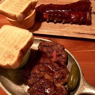 Half a rack of ribs with a regular ribeye steak.