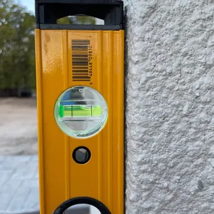 Front porch pillar is not even close to level on Delton's and Lucinda's Deal2Deal custom home.