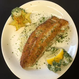 a plate of fish and vegetables