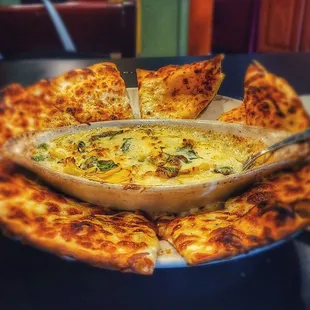 spinach and artichoke dip with baked pizza dough.  more than an appetizer