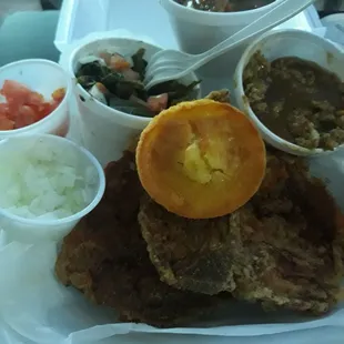 2 pork chops dinner:greens w/tomatoes &amp; onions, dressing w/gravy, candied yams,corn muffin