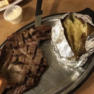 Ribeye and baked potato with Texas toast
