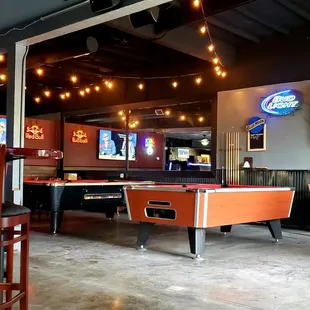 a billiards table in a sports bar