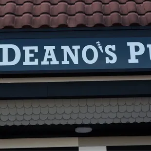 a sign for deano&apos;s pub