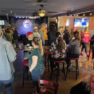 a crowd of people in a bar