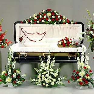 Customized sympathy tributes ranging from casketpieces, easel sprays, rosary lid pieces and pedestal arrangements
