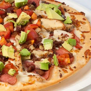 The Avocado Club- Seasoned chicken, crumbled bacon, ham, tomatoes and fresh avocado with our white sauce