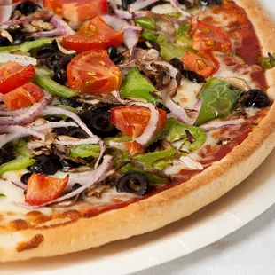 Veggie Pizza- Mushrooms, black olives, green bell peppers, tomatoes, onions and mozzarella