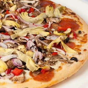 Antipasto Pizza- Parmesan, oregano, garlic, sundried tomatoes, spinach, aged Gallo salami, marinated artichokes, bell pepper and mozzarella