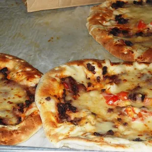Several varieties of pizza bread
