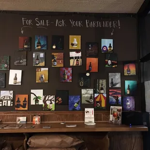 a bar with a lot of pictures on the wall