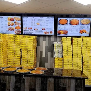 pizza boxes stacked on top of each other