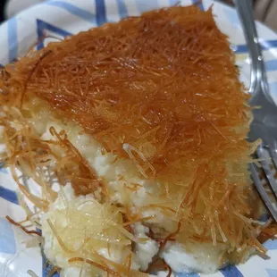 a piece of cheese cake on a plate with a fork