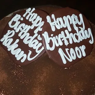 a chocolate birthday cake with white icing