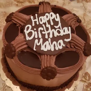 a chocolate birthday cake on a table