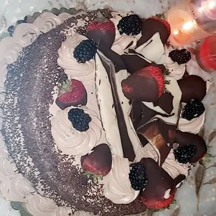 a chocolate cake with berries on top