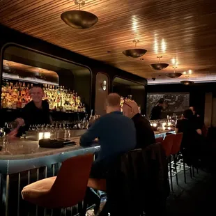 people sitting at a bar